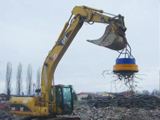 Electromagnet in action, using magnetism to recover ferrous scrap from a construction site.